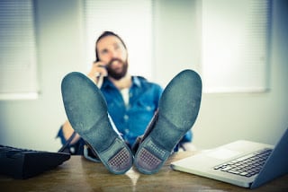 Image of a man relaxing while online